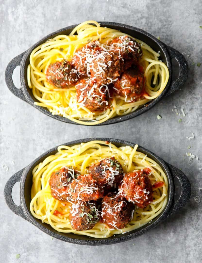 Two bowls of spaghetti and meatballs
