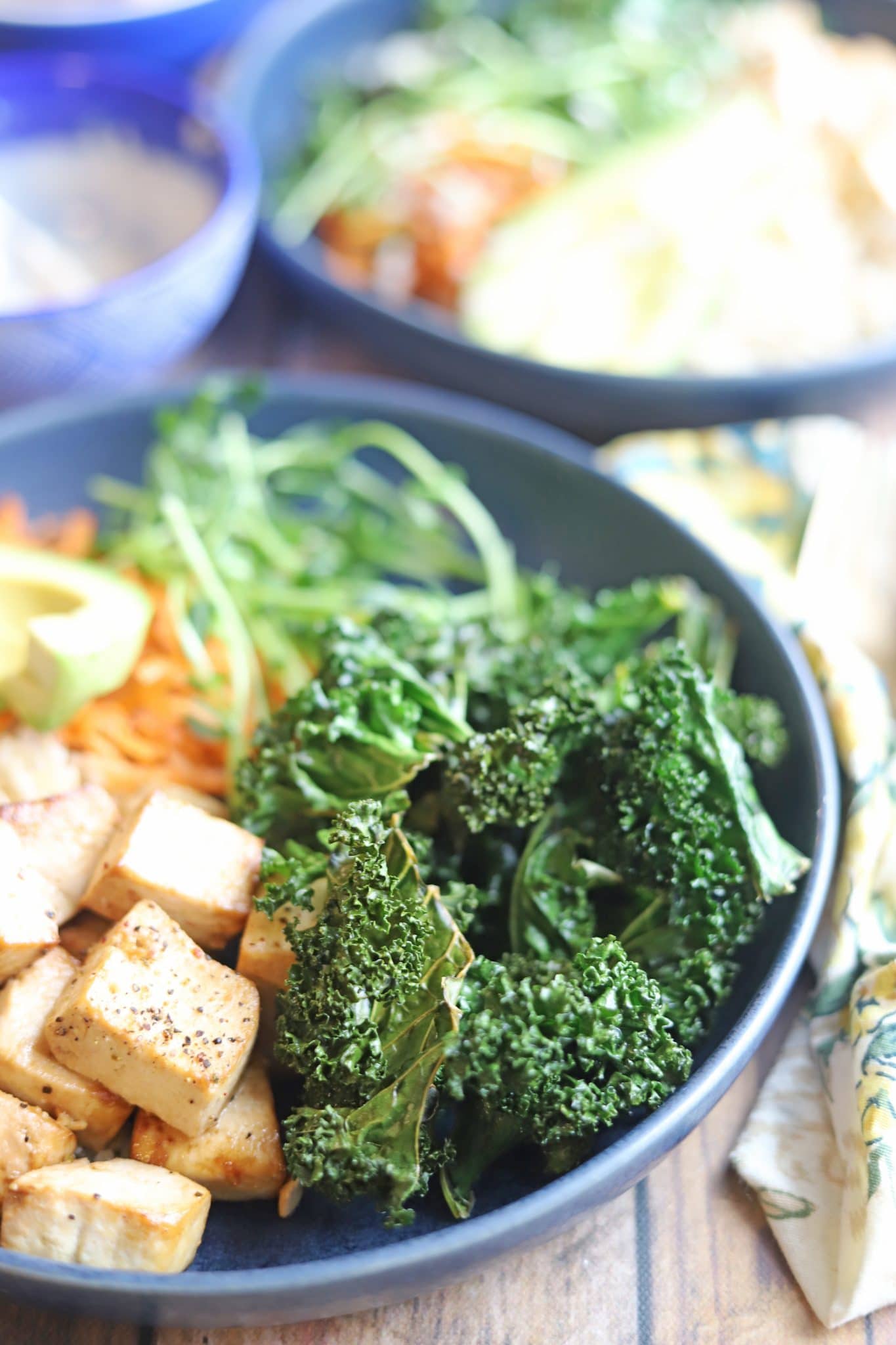 Kale chips in a gray bowl.
