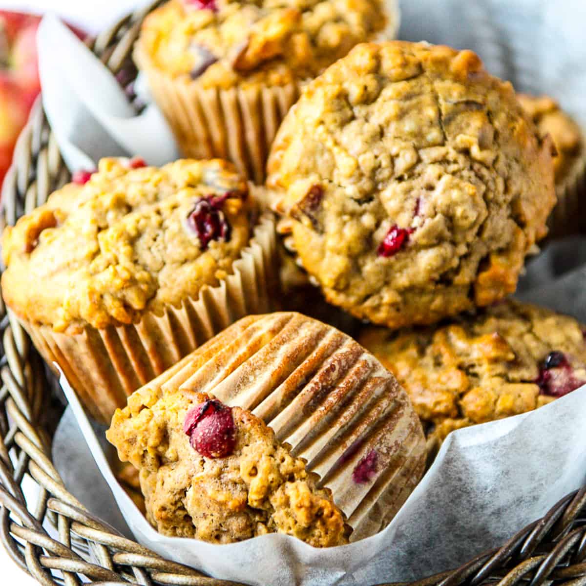 Cranberry oatmeal muffins in a basket.